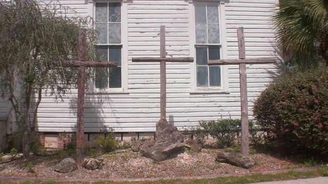 Three Wooden Crosses Outside of Old Church WIndows, 4K
