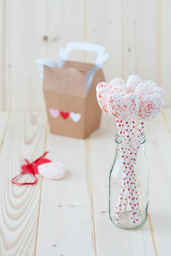 Heart shaped marshmallow bouquet . Gift box in the background 