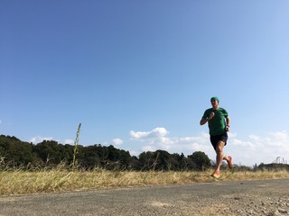 Male runner on country road