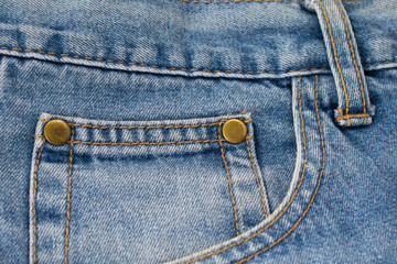 Blue denim jeans looking on pocket and clasper with macro style.