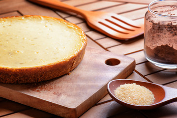 Freshly baked cheesecake on wooden board. Homemade dessert
