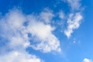 Fototapeta premium Bright blue sky & puffy clouds as background