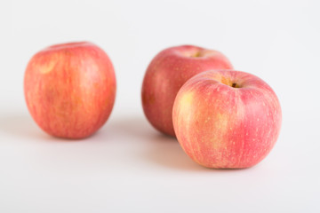 Fresh red apples on white background