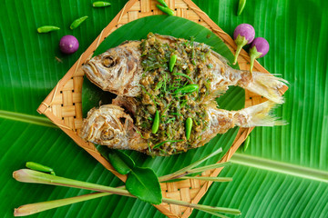 Deep fried fish with chlli sauce  on banana leaf