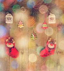 Red socks, present, pine, little Christmas tree on wood table