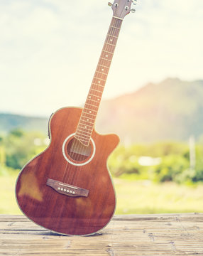 Guitar, nature and mountain background