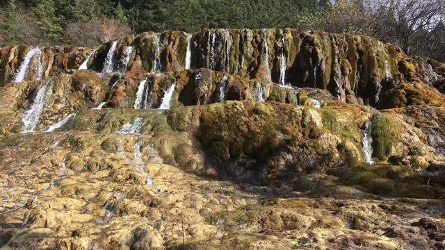 Huanglong Mountain with beautiful nature lime stone pond  ,waterfalls,lake  in Sichuan , China on sunny day