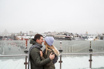 Young couple in love walking in the city, holding hands
