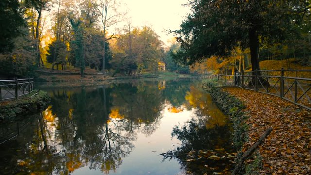 Quiet lake and classical temple at sunsrise in autumn
