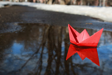 paper boat in a pool
