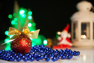 Red toy for fir on the background lights