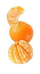 hanging, falling, soaring and flying tangerine fruits and peeled isolated on white background with clipping path