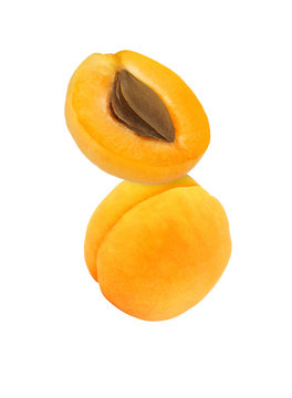 hanging, falling, hovering and flying whole and sliced apricot isolated on white background with clipping path
