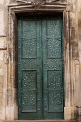 old grunge door decorated forge and rivets