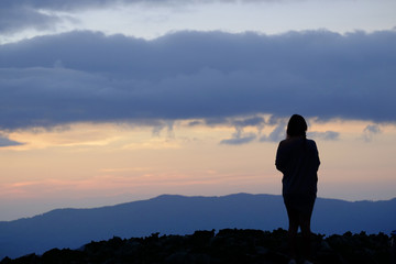 silhouette women standing on mountain background