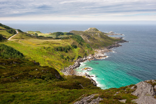 Sea shore landscape, view from the hill to lagoon with turquoise water and sea, Vagsoy island, Norway