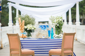 beautiful wedding setup and flowers on tropical beach background