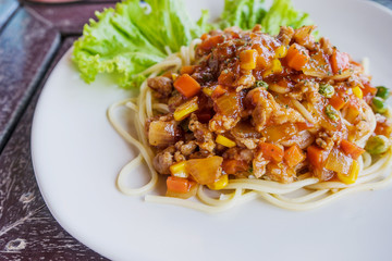 Pasta spaghetti with tomato sauce on table