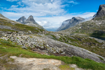 Landscape with asphalt road surrounded by mountains, on the way to Trollstigen, Norway