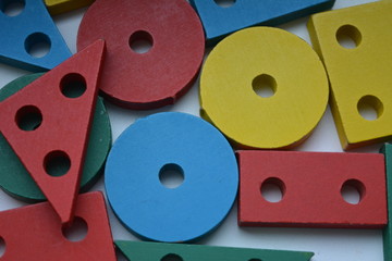 beautiful bright colorful geometric wooden background, texture, shapes, triangles, rectangles, circles, squares