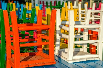 Colourful chairs in restaurant.