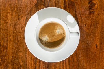 Cup of coffee on a wooden table