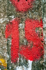 15 - shape red painting on beaten pillar