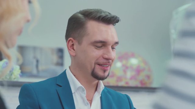 Portrait of beautiful and presentable man. The head of the marketing department. Brainstorm. Colleagues discussing new project. Male businessman with a neat beard. Metrosexual man.