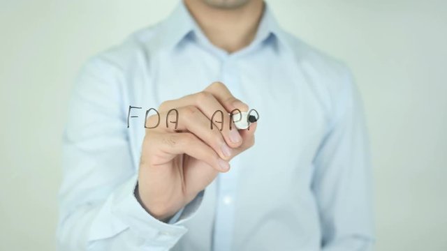 FDA Approved, Man Writing on Screen