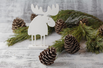 Funny christmas card with reindeer  for a greetings on a wooden