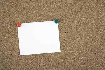 Sticky note on cork board