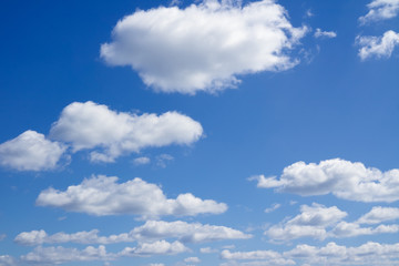 Naklejka na ściany i meble Clouds flying against blue sky. 