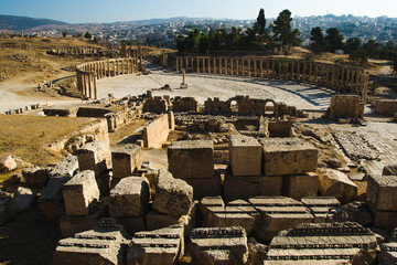 Ruins with building blocks sanctuary of Zeus Olympios and Oval Forum antique town Gerasa. Modern...