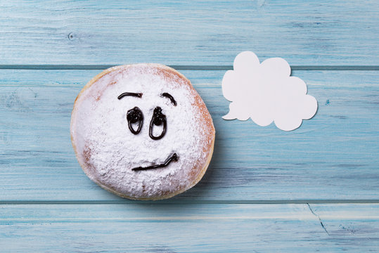 Donut With Smiley Face And Text Cloud, Wooden Background