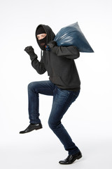 Thief with big blue bag