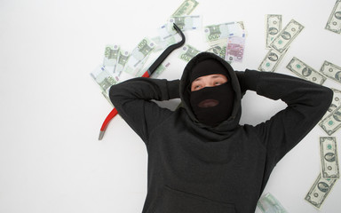Burglar lying with passkey , money