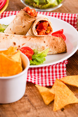 Tortilla wraps with chicken and vegetable.