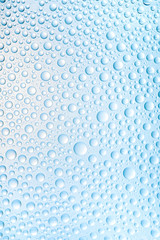 Blue water drops of on treat water-repellent surface in macro lens shot small-DOF for screen...