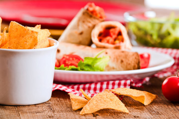 Tortilla wraps with chicken and vegetable.