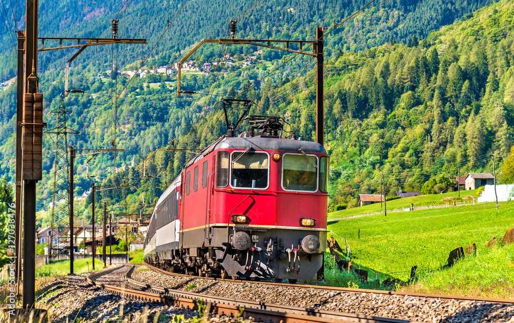 Wall mural Passenger train is going down the Gotthard pass - Switzerland