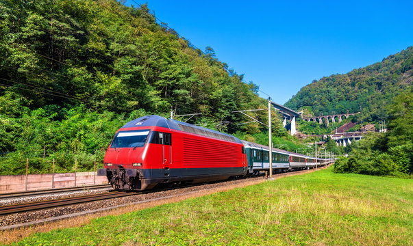 Fototapeta Passenger train is going down the Gotthard pass - Switzerland