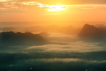 The landscape photo, beautiful sea fog in morning time at Sunrise Viewpoint, Phu Kradueng National Park in Thailand
