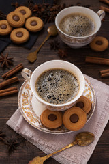 Coffee with chocolate biscuits and cinnamon