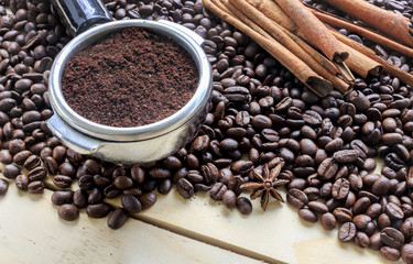 coffee beans on wood background, over light
