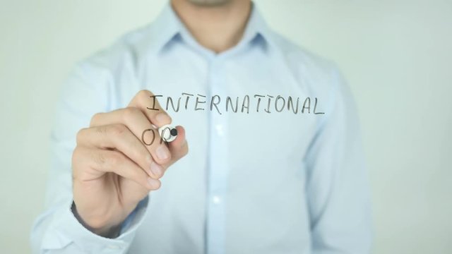 international Organization, Man Writing on Screen