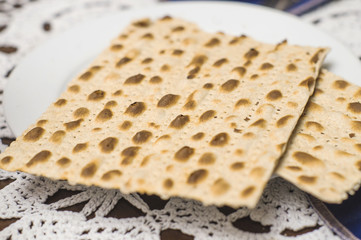 Matza on the plate. Matzah traditional food on the Jewish religious holiday feast of Passover.
