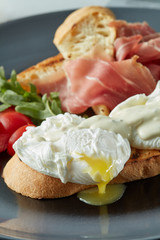 Eggs Benedict with bacon,