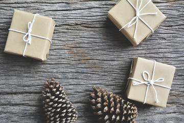 pine cones and gift on old wood.