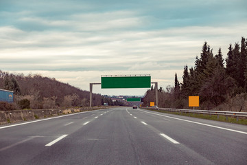 Blank road destination sign on motorway. Add your own text