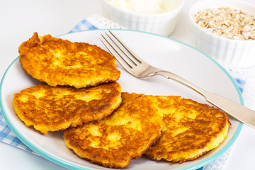 Pumpkin-oatmeal pancakes with curry on a white background